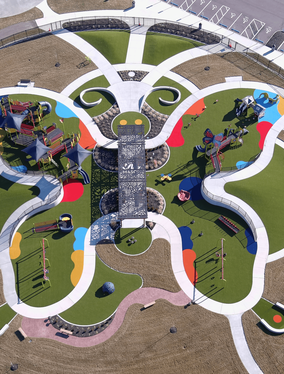 Common Ground Park - Mason, OH Colorful butterfly-shaped playground from above.