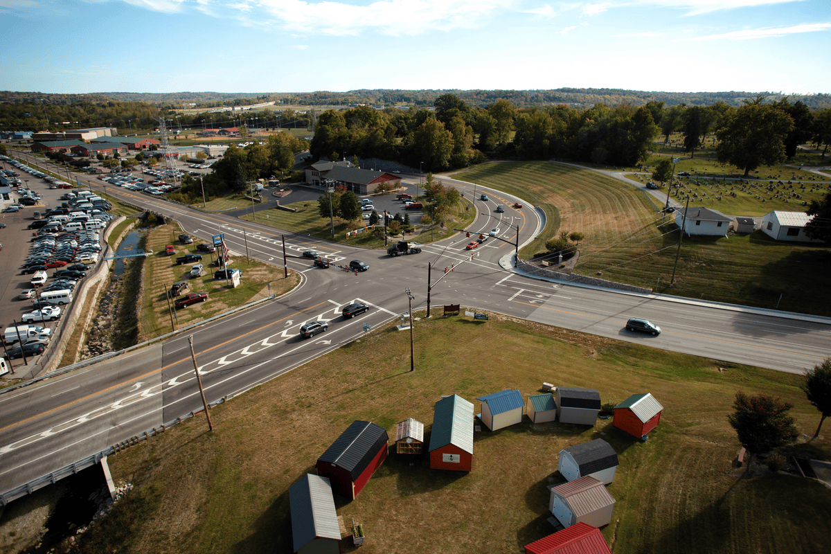 Milford Pkwy Improvements - Clermont County, OH Aerial view of a suburban intersection with small sheds and greenery.