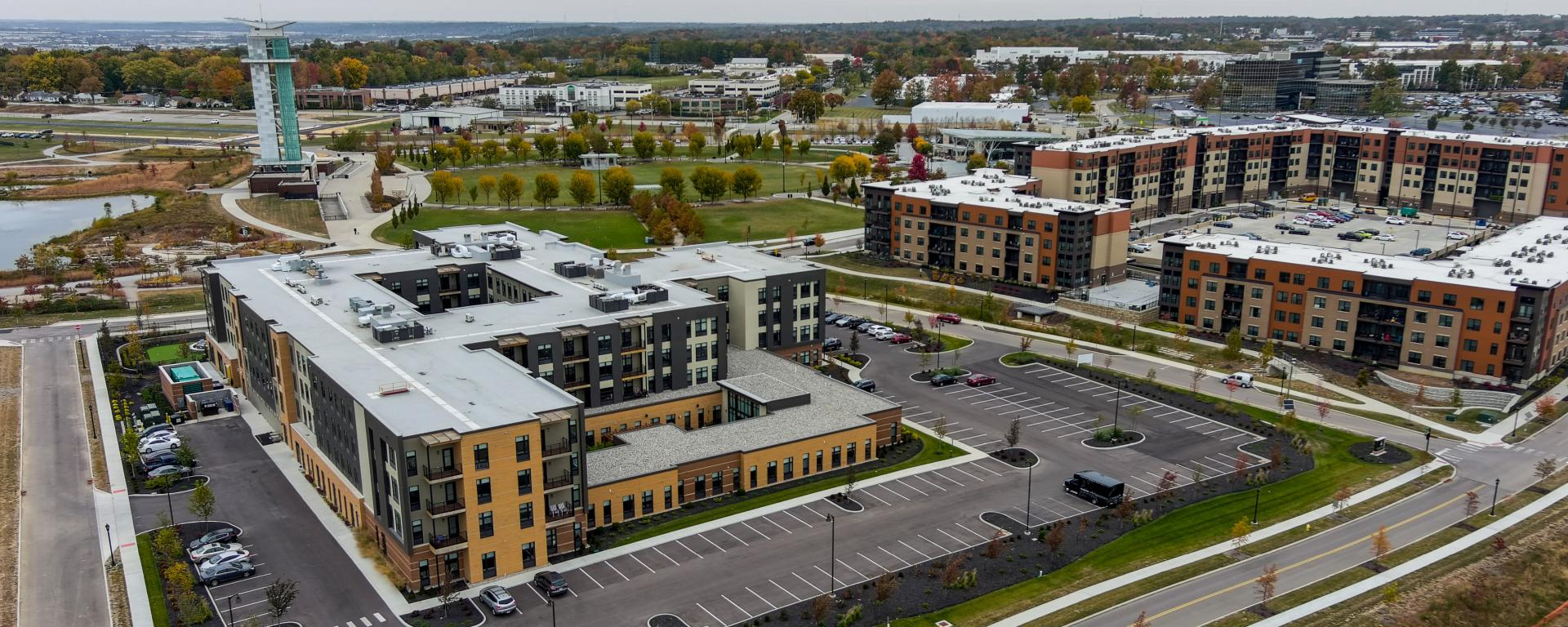 aerial photo of apartment building with park