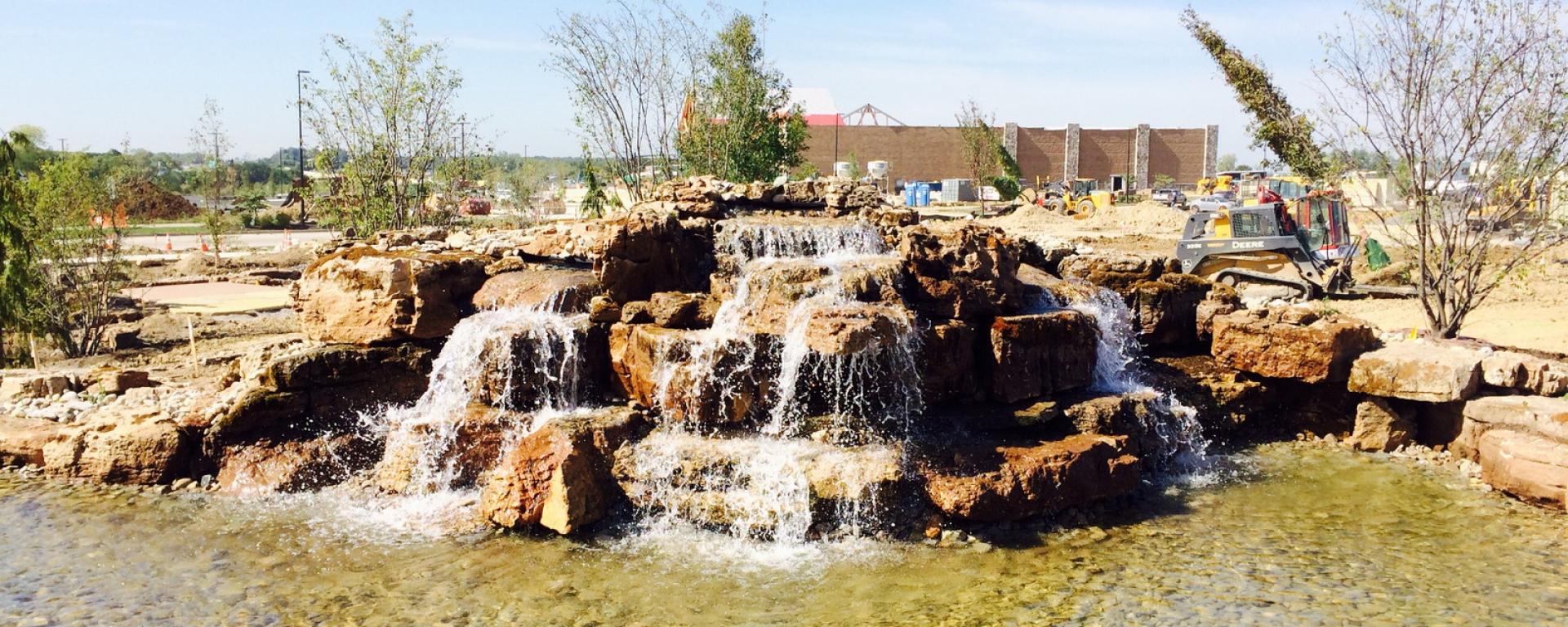 decorative fountain in pond