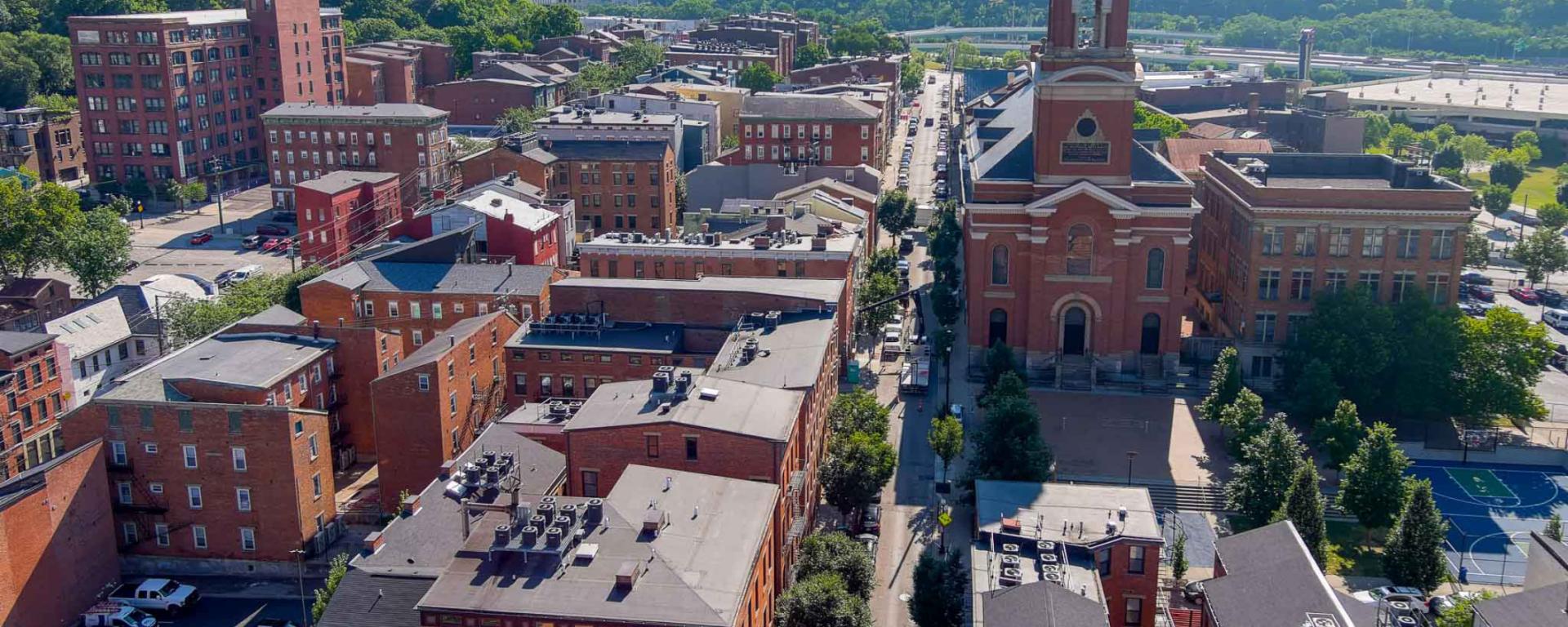 aerial photo of street and brick buildings