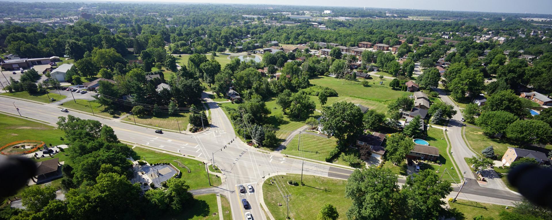 aerial photo of a roadway intersection with blue sky