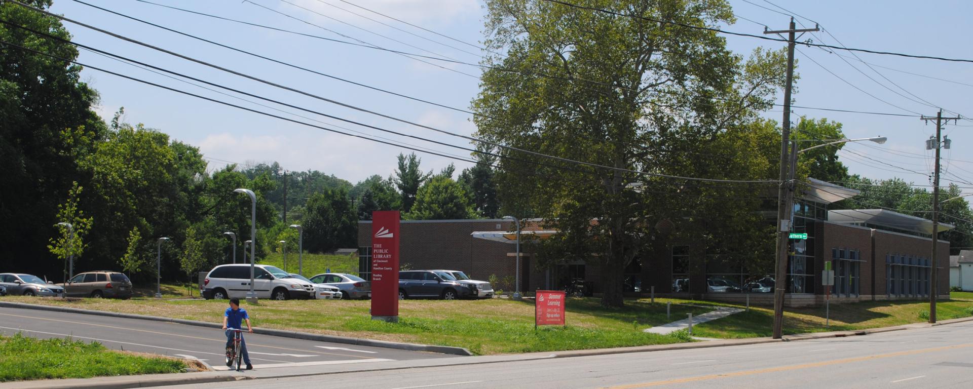 red library sign in front of brick building