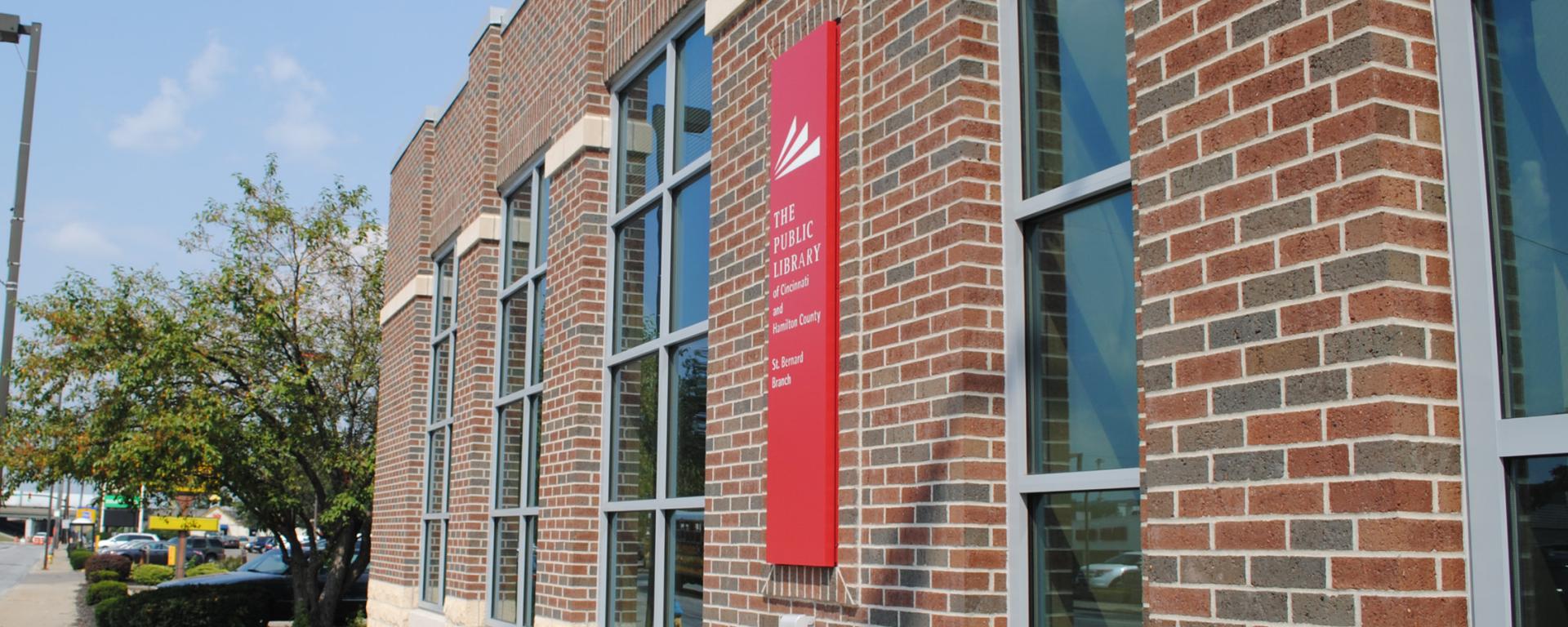 red library sign on brick building