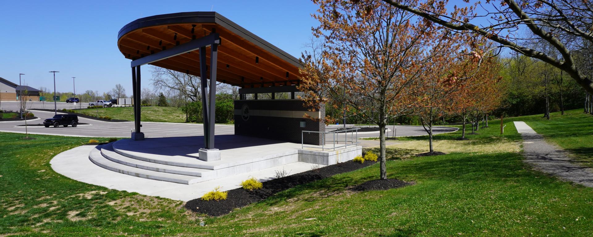 pavilian with wood roof and green grass