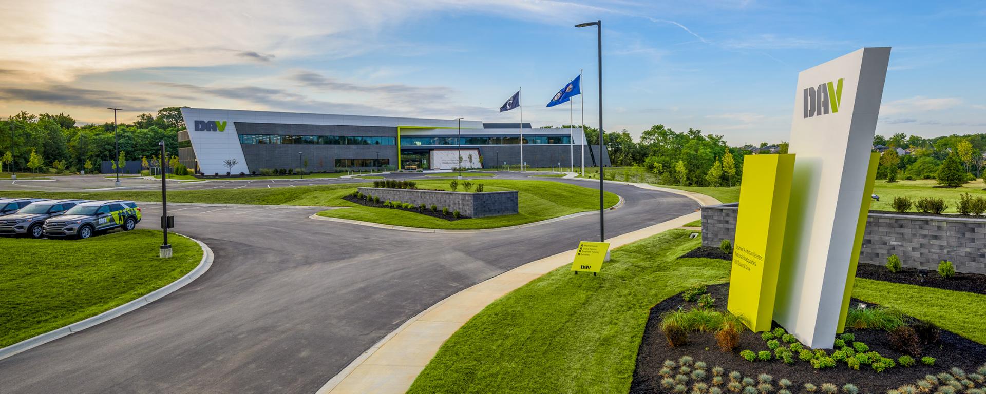 entry sign for office building with winding driveway