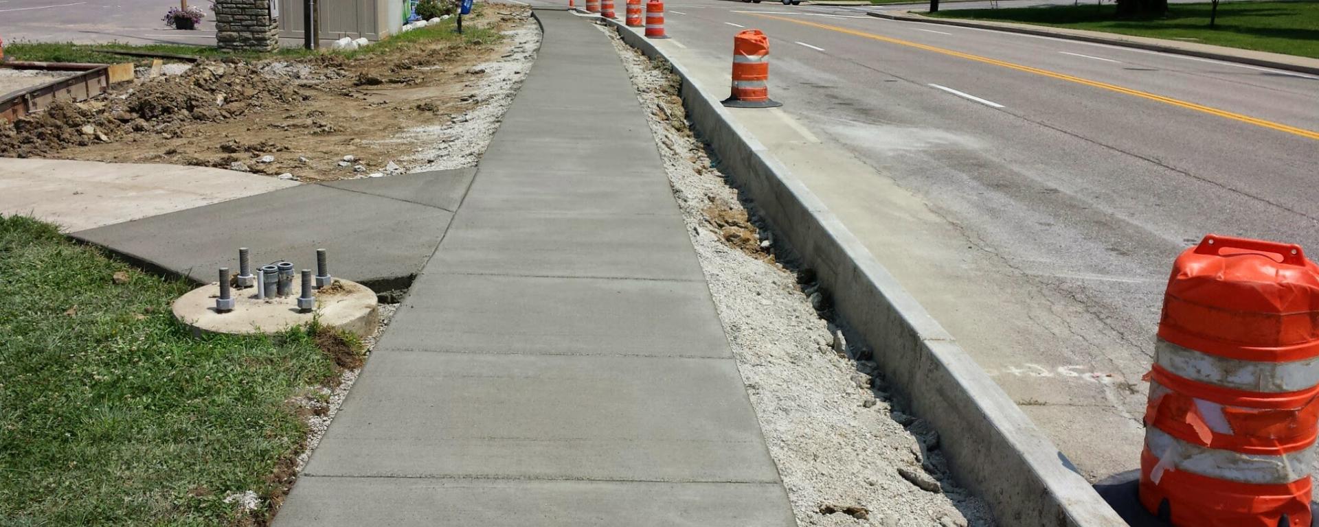 newly poured concrete sidewalk