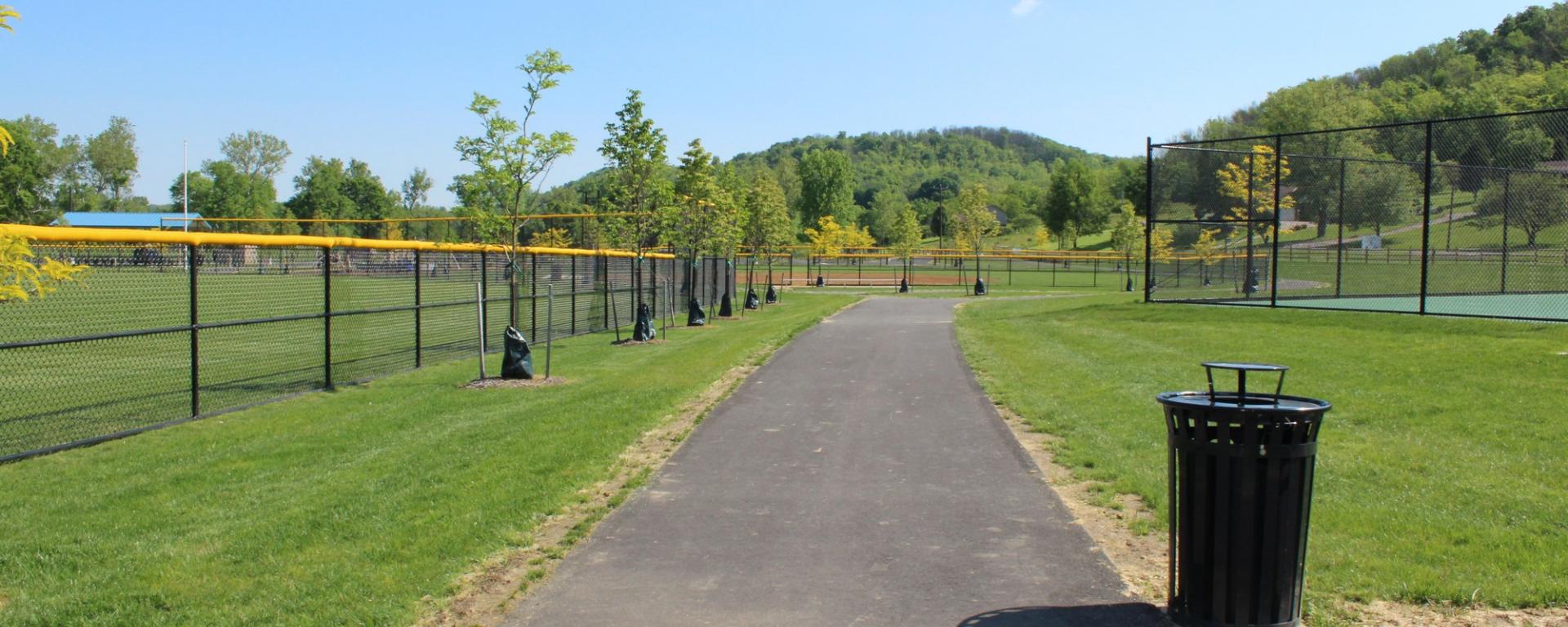 walkway alongside athletic fields