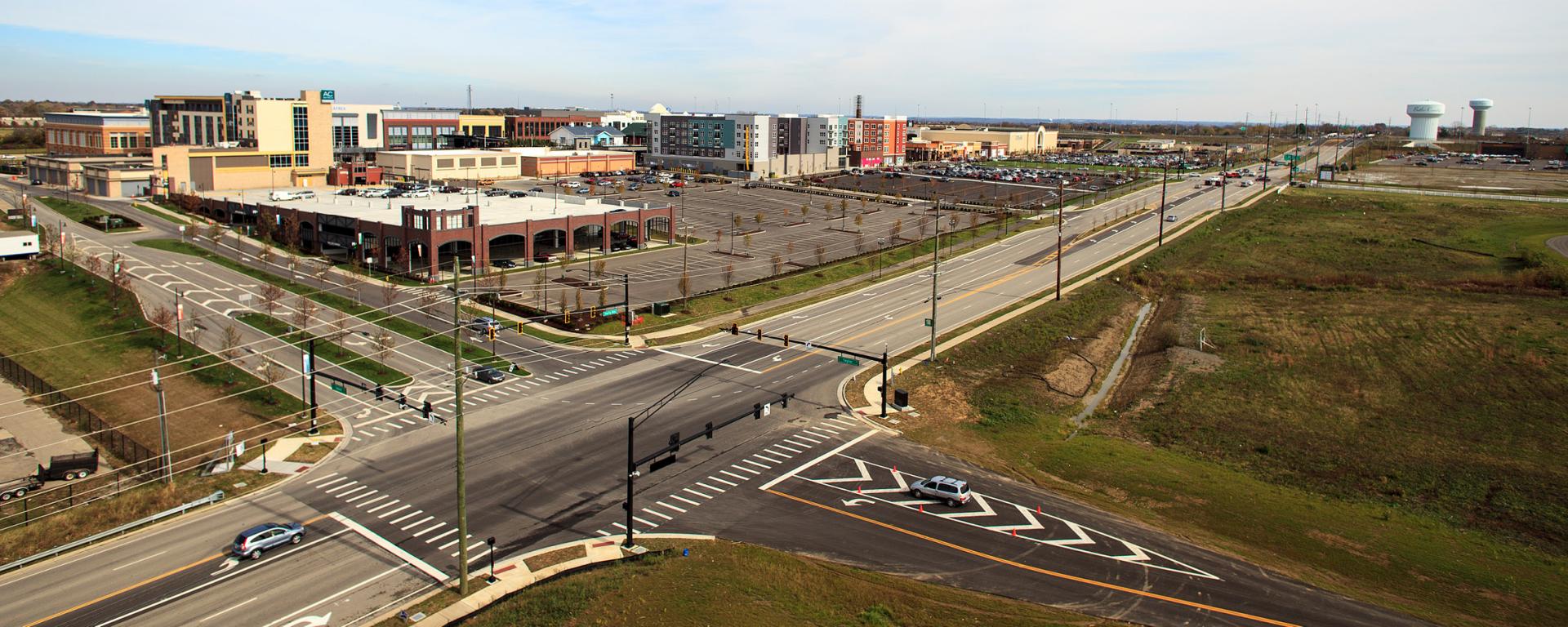 aerial photo of roadway and mixed use development