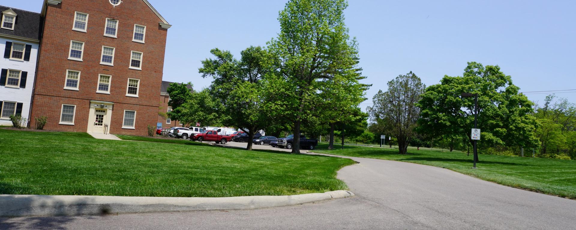 small driveway around a brick building