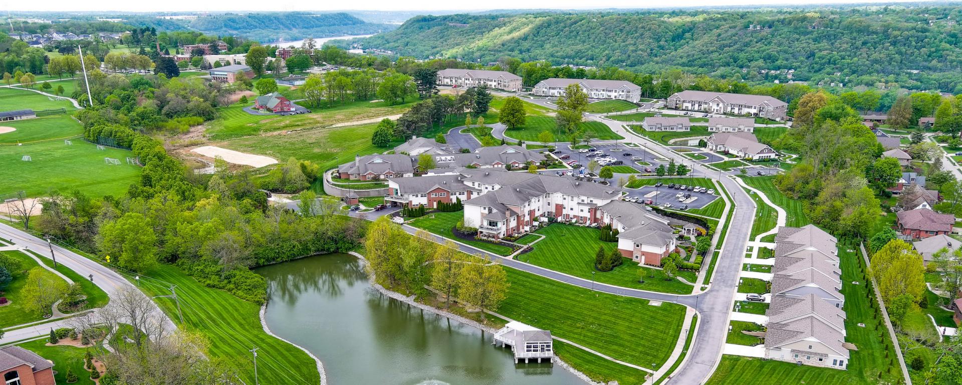 aerial photo of several building surrounding a lake