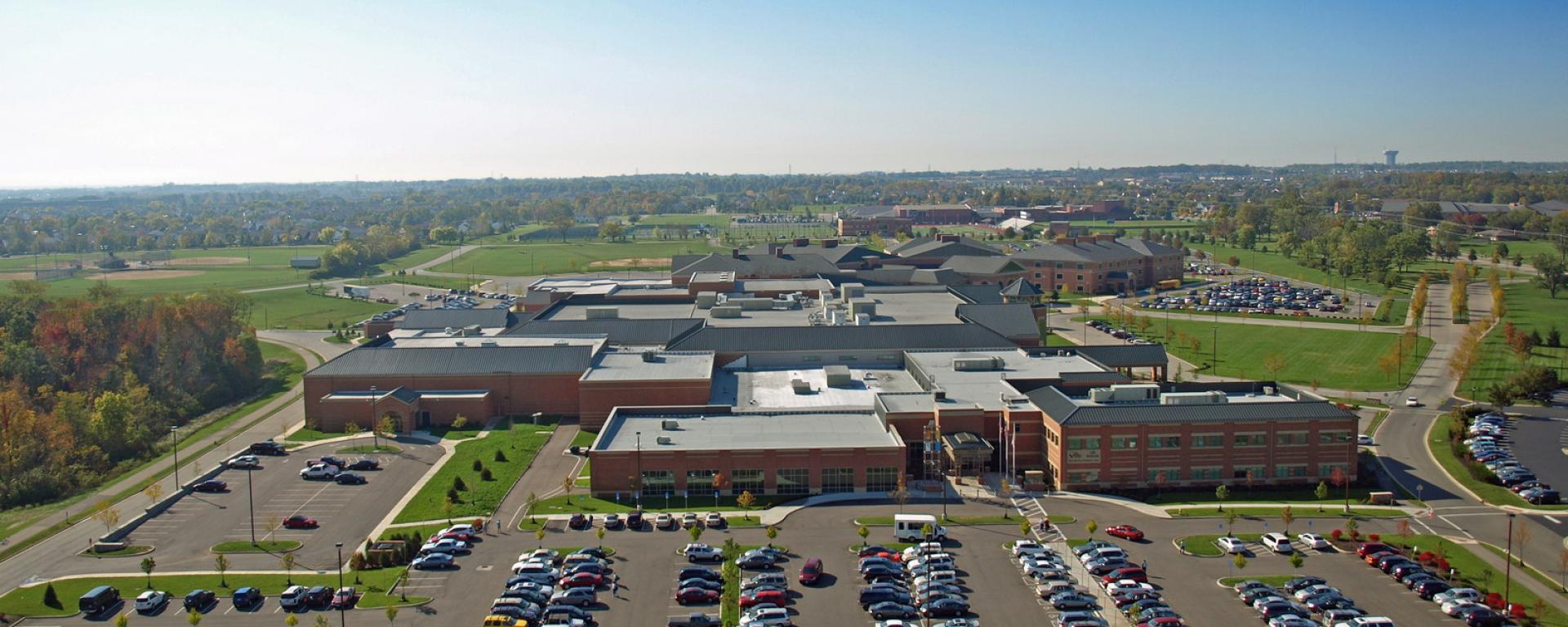 aerial of parking lot and front of building