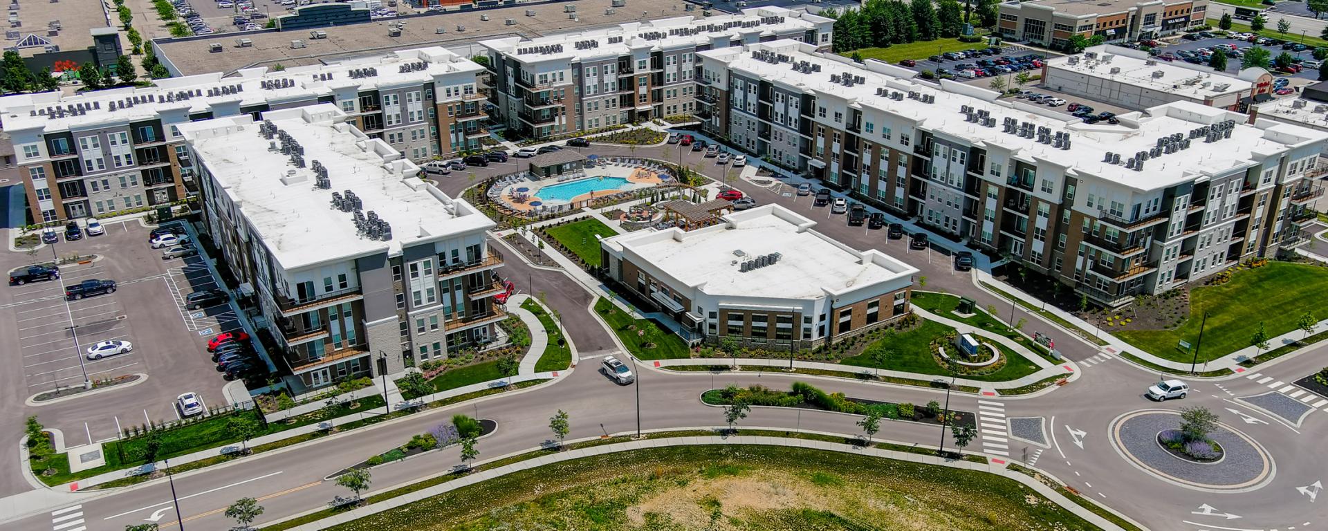 aerial photo of apartment building and winding road