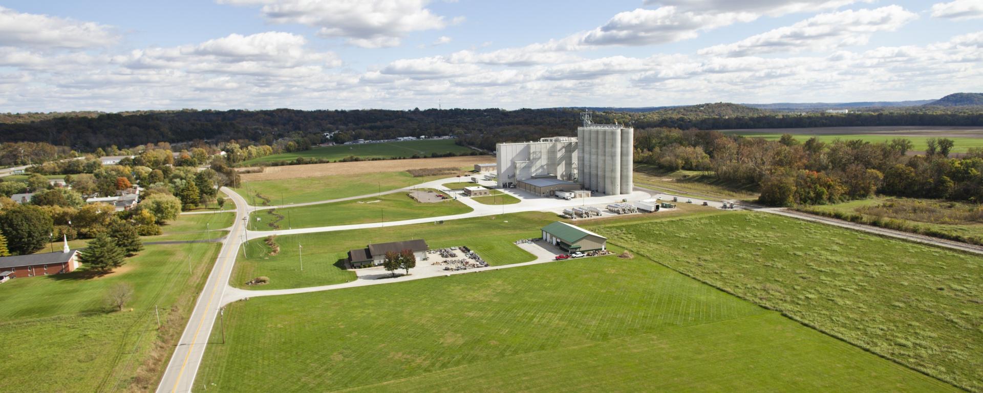 aerial of building and silos