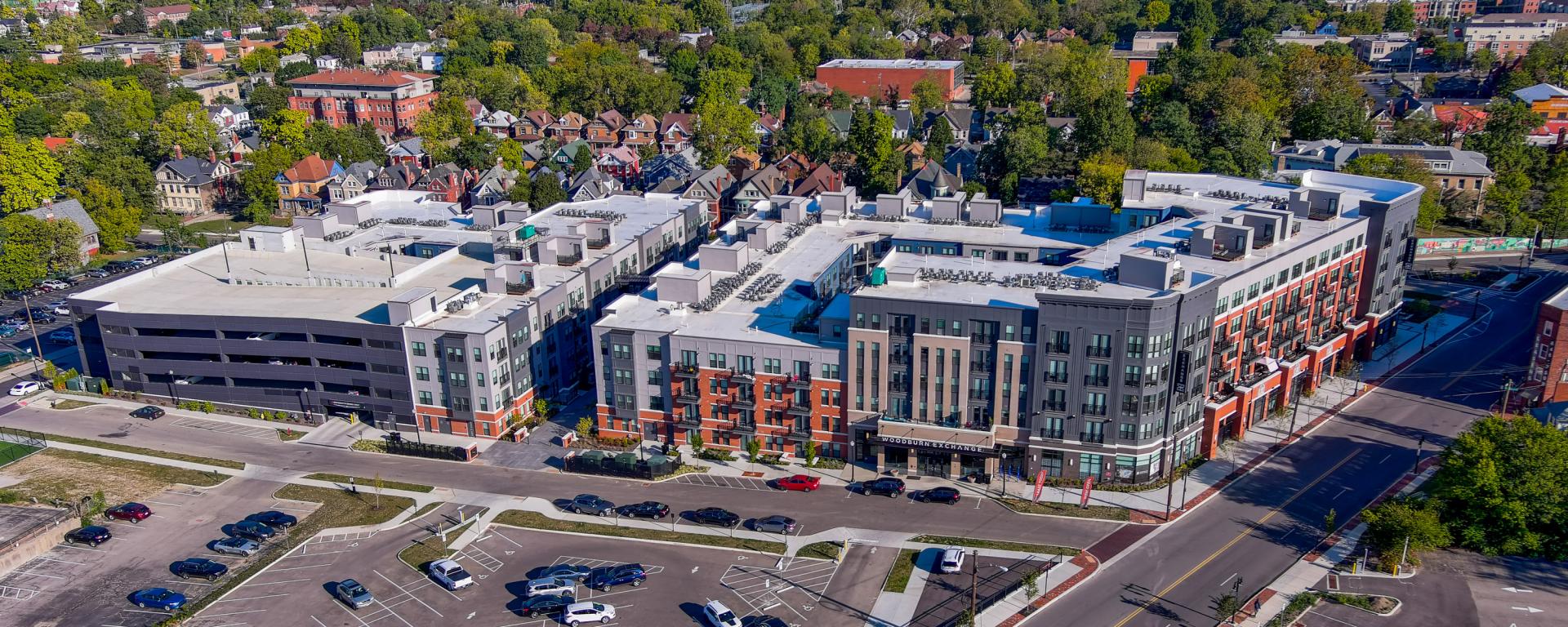 aerial photo of apartment building with parking garage