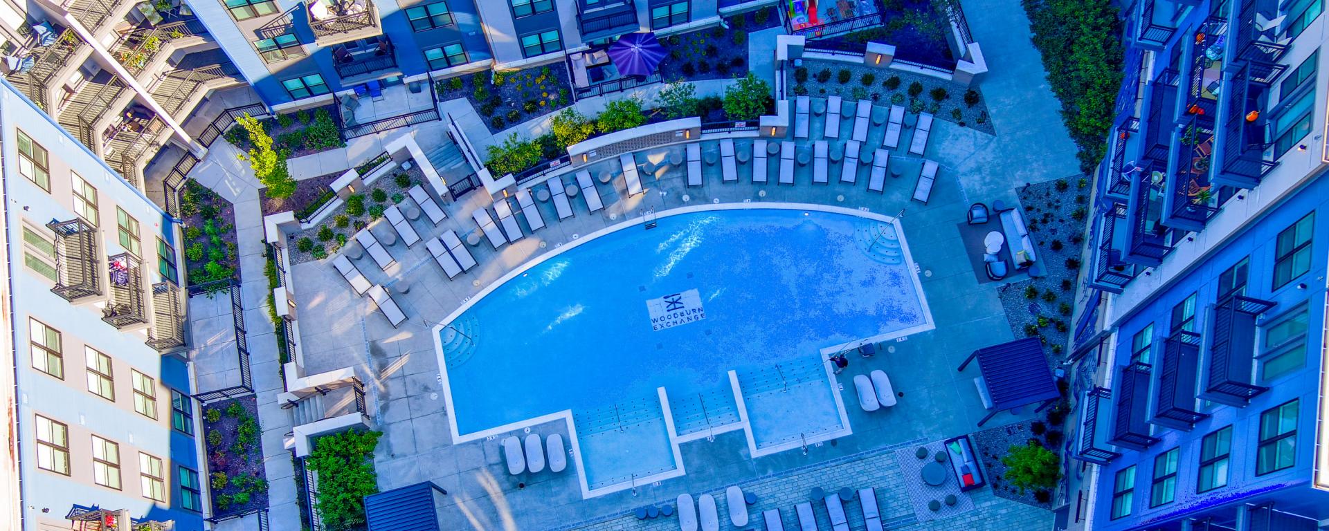aerial photo of apartment building courtyard with pool