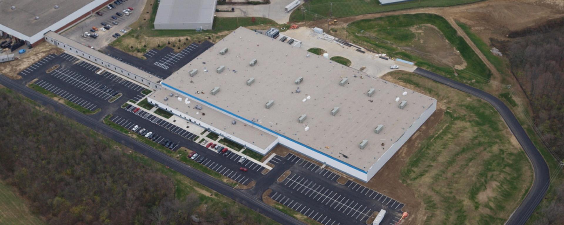 aerial of front of building and parking lot