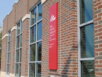 red library sign on brick building