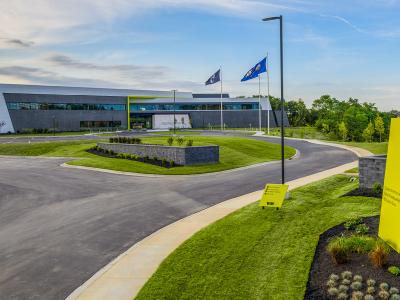 entry sign for office building with winding driveway