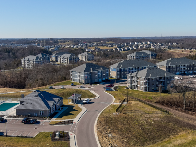 Elevation Apartment Homes - Alexandria, KY aerial photo of apartment buildings on a hill with a road
