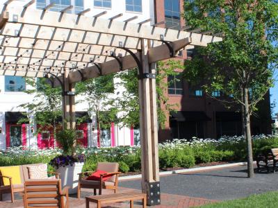 pergola and bench in park area