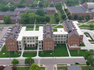 aerial photo of brick building and green lawn