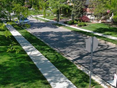 low altitude aerial photo of residential street and sidewalk