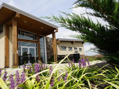 Metroparks of Butler County River Center park building with flowers
